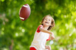 © famveldman - Family playing American football. Kids play rugby