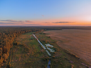 Wall Mural - Panorama of landscape sunset over the fields