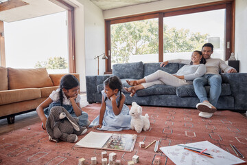 Poster - Family, sisters and playing on floor, living room and parents with smile, proud and relax on sofa in house. Lounge, woman and man with girls, book and drawing on ground of home, toys and education