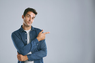 Aufkleber - Portrait, pointing and man with review, information and model on grey studio background. Face, person and guy with hand gesture, mockup space and promotion with discount deal, coming soon and support
