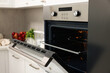 © New Africa - Open electric oven in kitchen. Cooking appliance