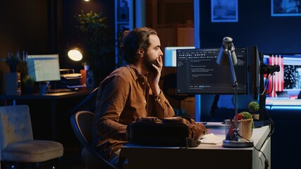 Poster - freelancing system administrator arriving in personal office at home, resuming work on coding. it ex