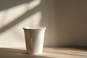 Poster - A white cup sits on top of a wooden table, perfect for a rustic or minimalist setting