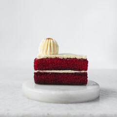 Sticker - slice of red velvet cake with cream cheese frosting, moist red velvet pound cake with buttercream frosting and filling on a white background