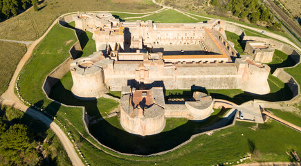 Wall Mural - Aerial view of countryside of Northern Catalonia with massive ancient Fort de Salses, France