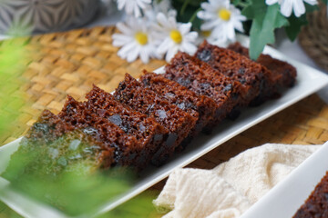 Kek Buah Kukus, a traditional Malaysian steamed fruit cake filled with dried fruits, nuts, and spices