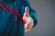 © Bordinthorn - Businessman offering handshake with declining chart symbolizing business failure, financial crisis, or economic recession.