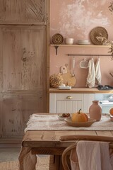 Kitchen interior with a wooden table, a basket with pumpkins and a plaid