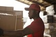 © AI Farm - A focused worker in a red uniform carrying a cardboard box in a warehouse. Bright sunlight highlights his determination.