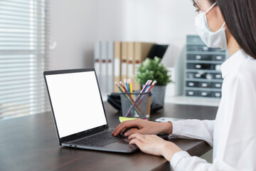 Aufkleber - Woman hand using laptop and type on the keyboard, Mockup screen of advertisement.