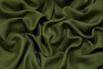 Wall Mural - Green fabric background. Green cloth waves background texture. Green fabric cloth textile material.