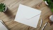 © sirirat - Blank paper and a blank white envelope lay on the modern office desk for resign work , mockup