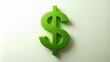 © Wanlop - A lush green dollar sign icon rests on a crisp white background, surrounded by subtle gradient and soft shadows.