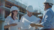 © WARIS ALI - A group of and planners reviewing on a large construction site. The scene includes detailed plans, construction progress, and a collaborative discussion among the team