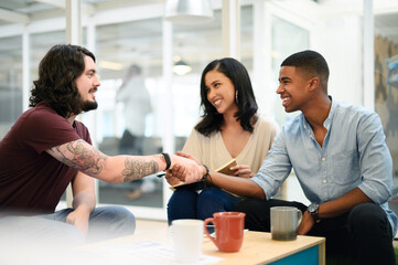 Aufkleber - Business people, meeting and greeting with handshake for agreement, deal or introdution at office lounge. Businessman shaking hands with employees for thank you, parthnership or b2b at workplace