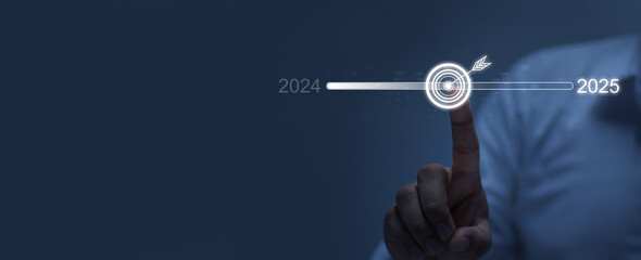 Wall Mural - businessman touching on target on virtual screen To change from 2024 to 2025, countdown to Merry Christmas and Happy New Year 2025, new life ideas, technology, business, start, target