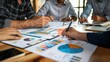 © Naknakhone - Business consulting meeting is discussing business plan analysis with financial data and business growth charts to plan strategies for generating company profits. copy space.