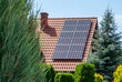 © Luci - House roof with photovoltaic modules. Historic farm house with modern solar panels on roof and wall High quality photo