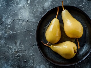 Poached Pears Perfection: A Close-Up Culinary Delight on Dark Stone Background