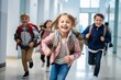 © Dzmitry Halavach - Joyful school children running down the hallway, excited and energetic