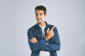 Aufkleber - Portrait, pointing and man with review, option and model on grey studio background. Face, person and guy with hand gesture, mockup space and promotion with discount deal, information and opportunity