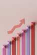 © Westend61 - 3D render of multi colored growing bar graph with arrow over pink background