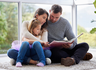 Wall Mural - Family, reading and girl with story in home, bonding and love for child development and imagination. Storytelling, fiction and kid or people in apartment, concentration or literacy growth with care