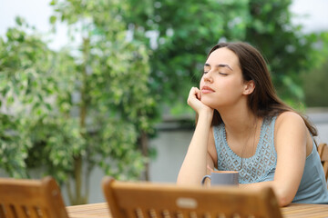 Wall Mural - Woman relaxing in a garden at home