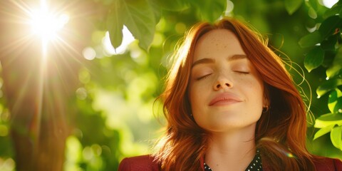 Wall Mural - woman enjoying nature's beauty with eyes closed