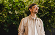 © Jacob Lund - Happy business man standing in an environmentally friendly office