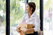 © David - Startup small business entrepreneur or freelance Asian woman using a laptop with box, Young success Asian woman with her hand lift up, online marketing packaging box and delivery, SME concept.