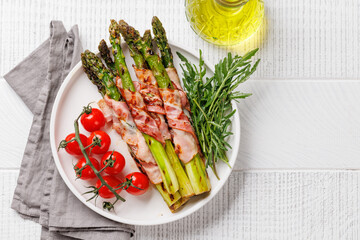 Wall Mural - Grilled asparagus with bacon and egg sauce on a plate