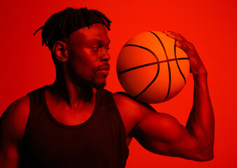 Poster - Arm, basketball and fitness with man in red filter lighting for challenge, game or performance. Bicep, exercise and sports with African person training in studio for competition, health or recreation