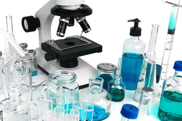 A lab table with many different colored bottles and beakers. The table is set up for a science experiment