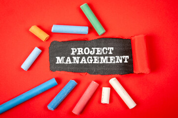 Wall Mural - Project management. Text under torn red paper on a blackboard