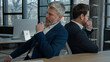 © Yuliia - Two sad disappointed stressed worried caucasian businessmen men colleagues business partners entrepreneurs frustrated by bad news think about financial problem failure in office failed business deal