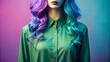 © Wanlop - Vibrant green shirt with blue and purple ombre hair strands draped over a velvet mannequin against a soft pastel background.