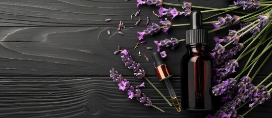 Poster - A lavender scented product sample is displayed with a dropper next to flowers on a black wooden table with a blank space for an image