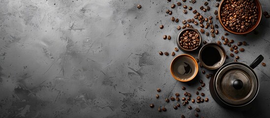 Fototapete - Coffee brewing pot and beans on concrete background with ample copy space image