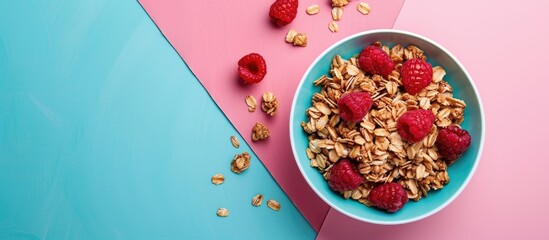 Wall Mural - Flat lay showcasing a delicious granola with raspberries on a colorful pink and turquoise backdrop emphasizing a healthy breakfast idea with copy space image