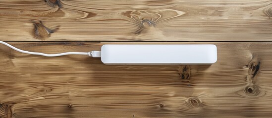 Poster - Empty white power strip on a wooden table with copy space image