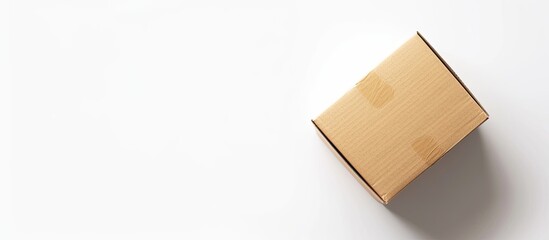 Aufkleber - Carton box parcel with a blank cap seen from a perspective angle on a white background suitable for copy space image