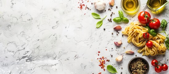 Fototapete - An Italian inspired Mediterranean dinner concept with ingredients like dried pasta garlic olive oil basil and tomatoes on a white stone background for a top view with copy space image