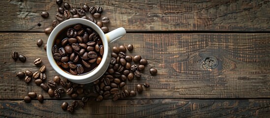 Fototapete - Top down view of a coffee cup beans on a vintage table with space for text or image insertion. with copy space image. Place for adding text or design