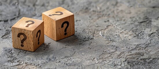 Aufkleber - Three wooden cubes with question marks on a grey background with a copy space image