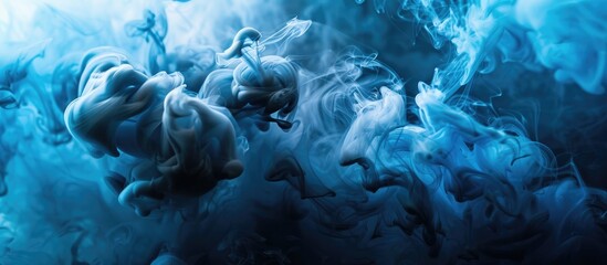 Poster - Blue and black ink swirling in water, creating a colored abstract smoke explosion effect. Perfect for an abstract background with copy space image.