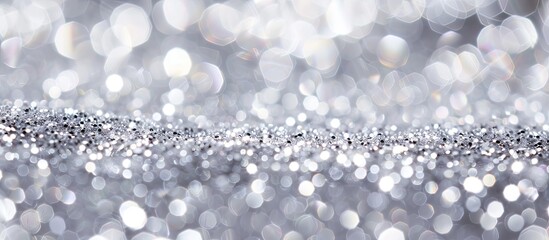 Poster - Shiny silver background with sparkling glitter embellishments providing ample copy space image.