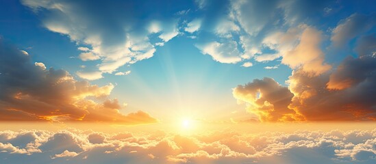Aufkleber - Golden clouds illuminated by the evening sunlight against a blue sky provide a tranquil ambiance in the copy space image.