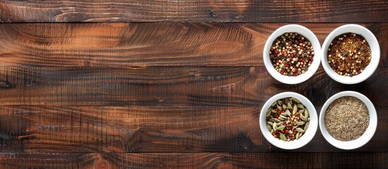 Poster - Top view of spices in small white bowls on a brown wooden backdrop suitable for pilaf ingredients with a vacant area for text like a copy space image