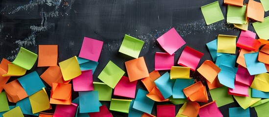 Poster - Vibrantly colored post it notes against a blackboard background with copy space image